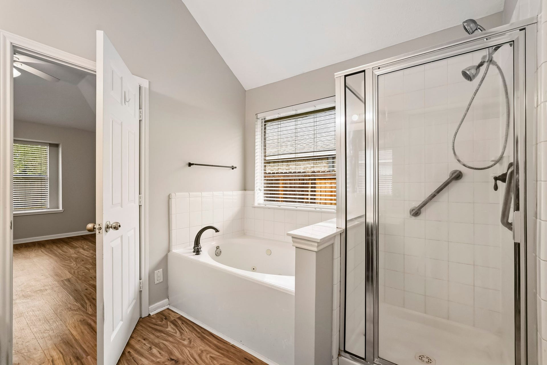 14319 Floret Estates Court, Cypress, TX 77429 The private primary suite features an en-suite bath with double sinks, soaking tub and separate walk-in shower.