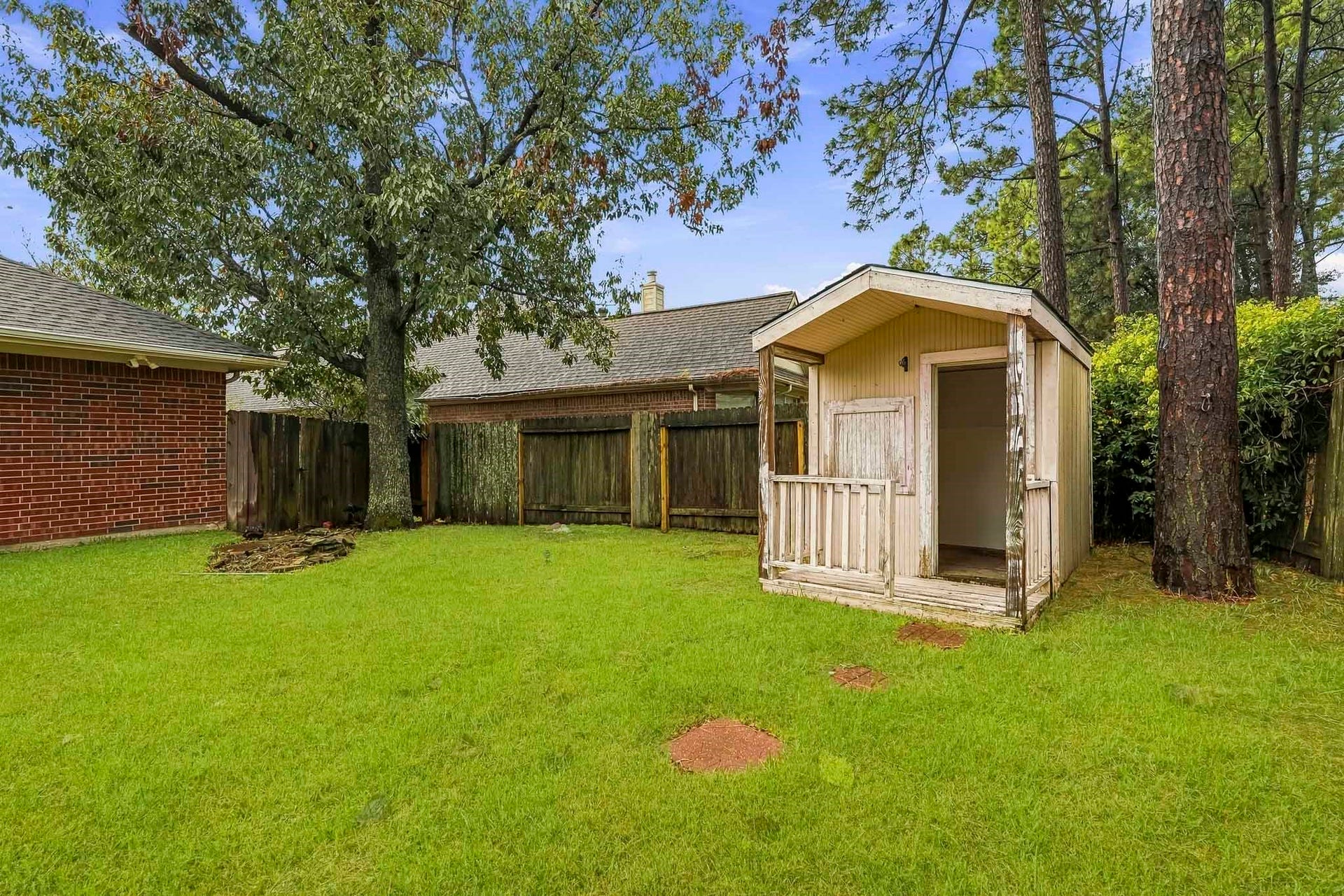 14319 Floret Estates Court, Cypress, TX 77429 Enjoy a large backyard with a covered patio, perfect for relaxing or entertaining.