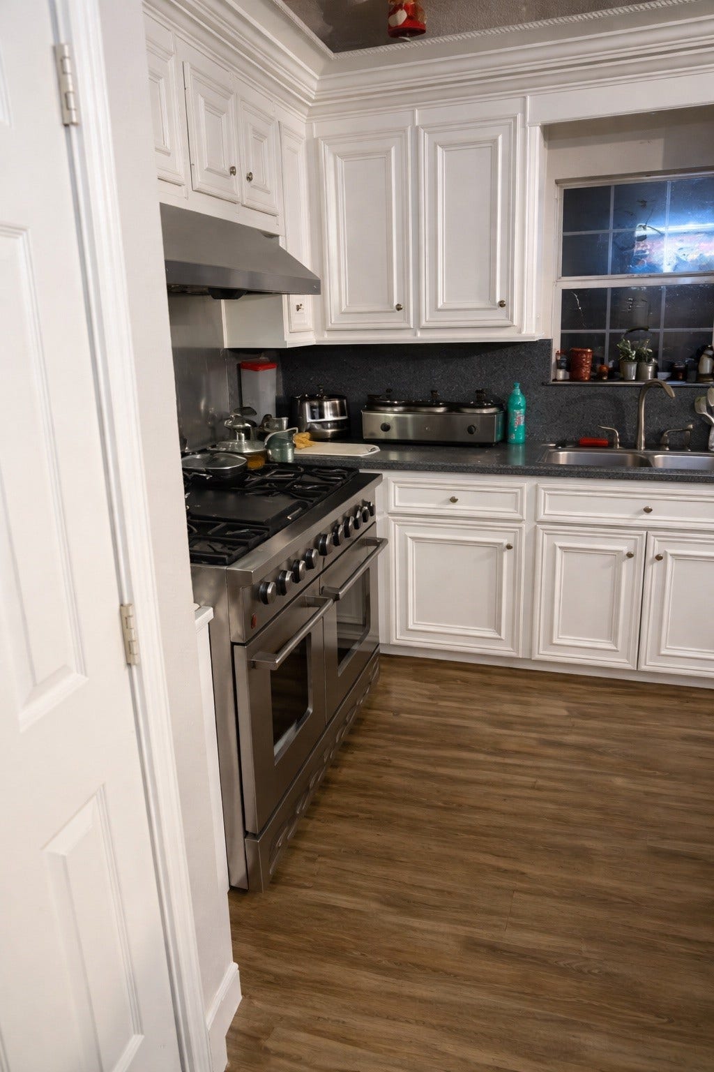 431 Hana Drive, Tiki Island, TX 77554 Kitchen with white cabinetry