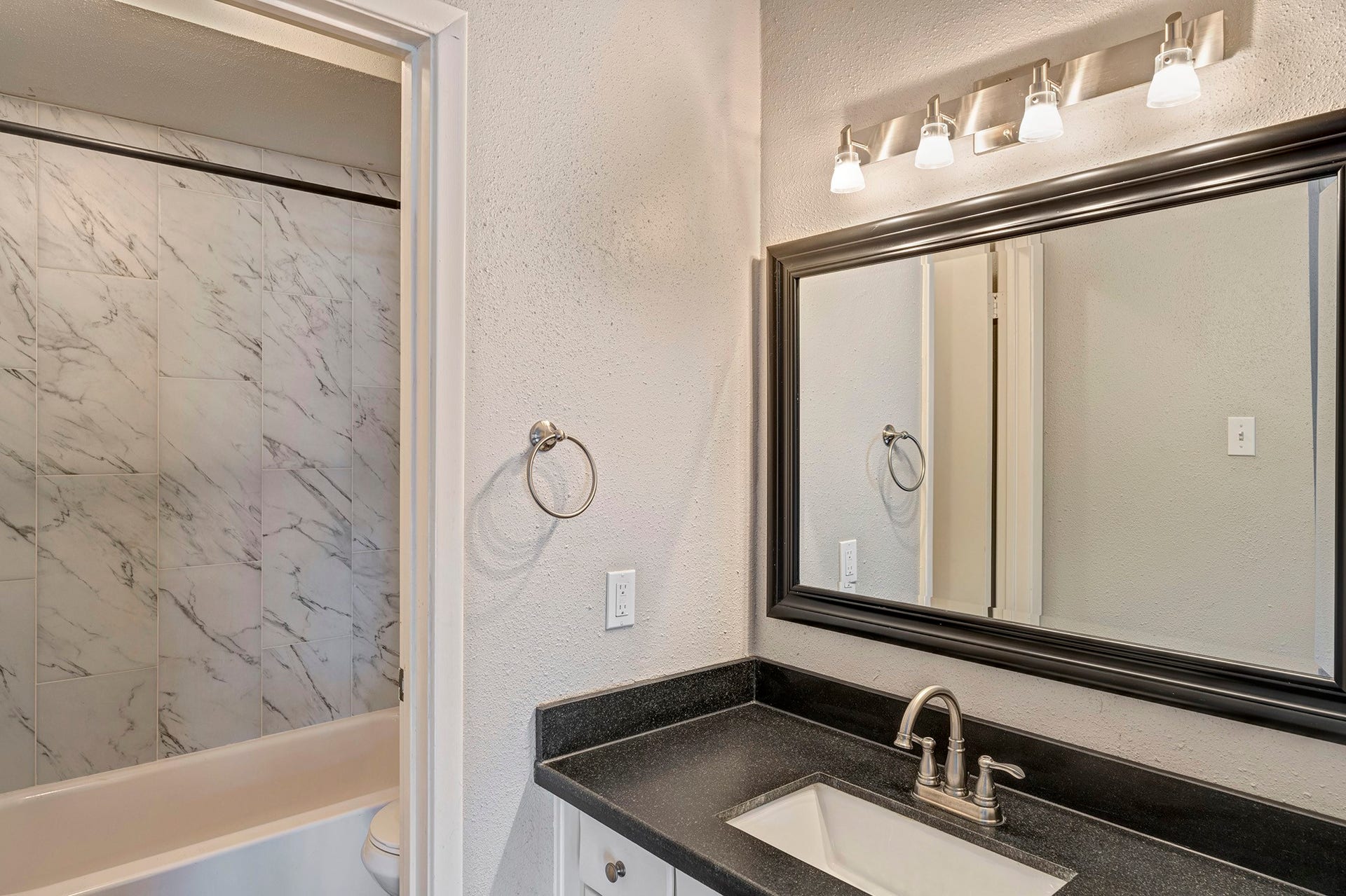 5005 Georgi Lane, #165, Houston, TX 77092 En suite bathroom with granite vanity and shower/tub.