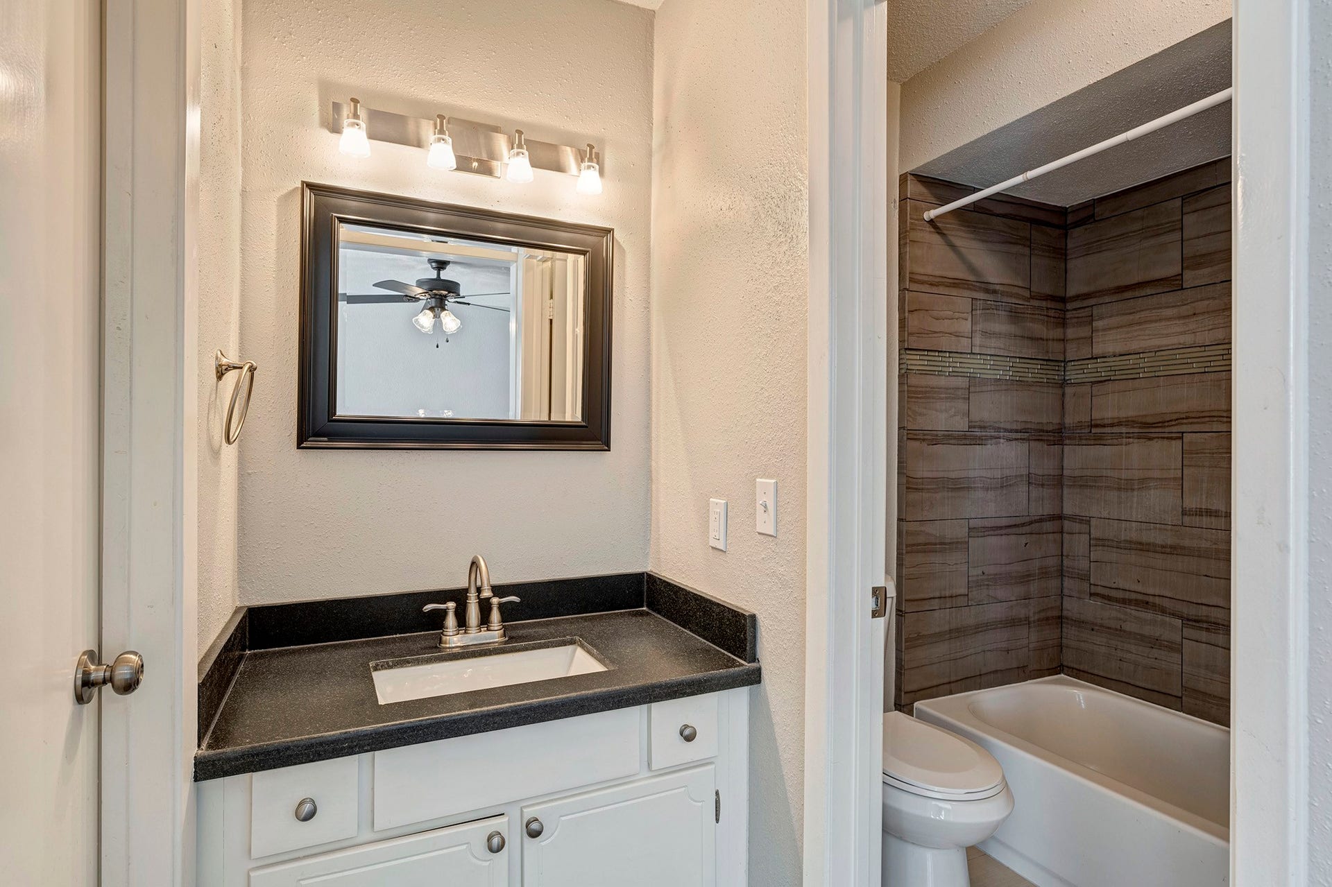 5005 Georgi Lane, #165, Houston, TX 77092 En suite bath for front bedroom has walk-in closet, granite vanity and shower/tub.