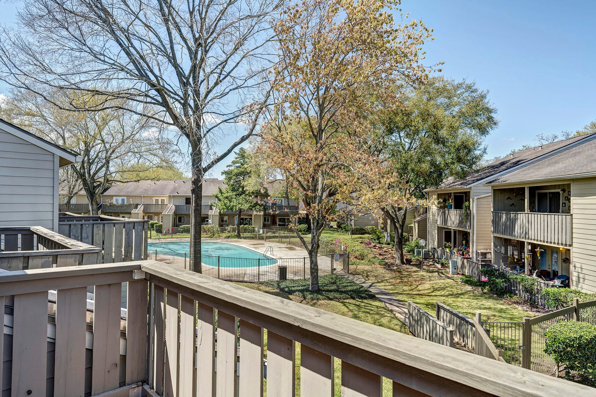 5005 Georgi Lane, #165, Houston, TX 77092 Upstairs balcony off the back bedroom overlooks the interior grounds and nearby pool.