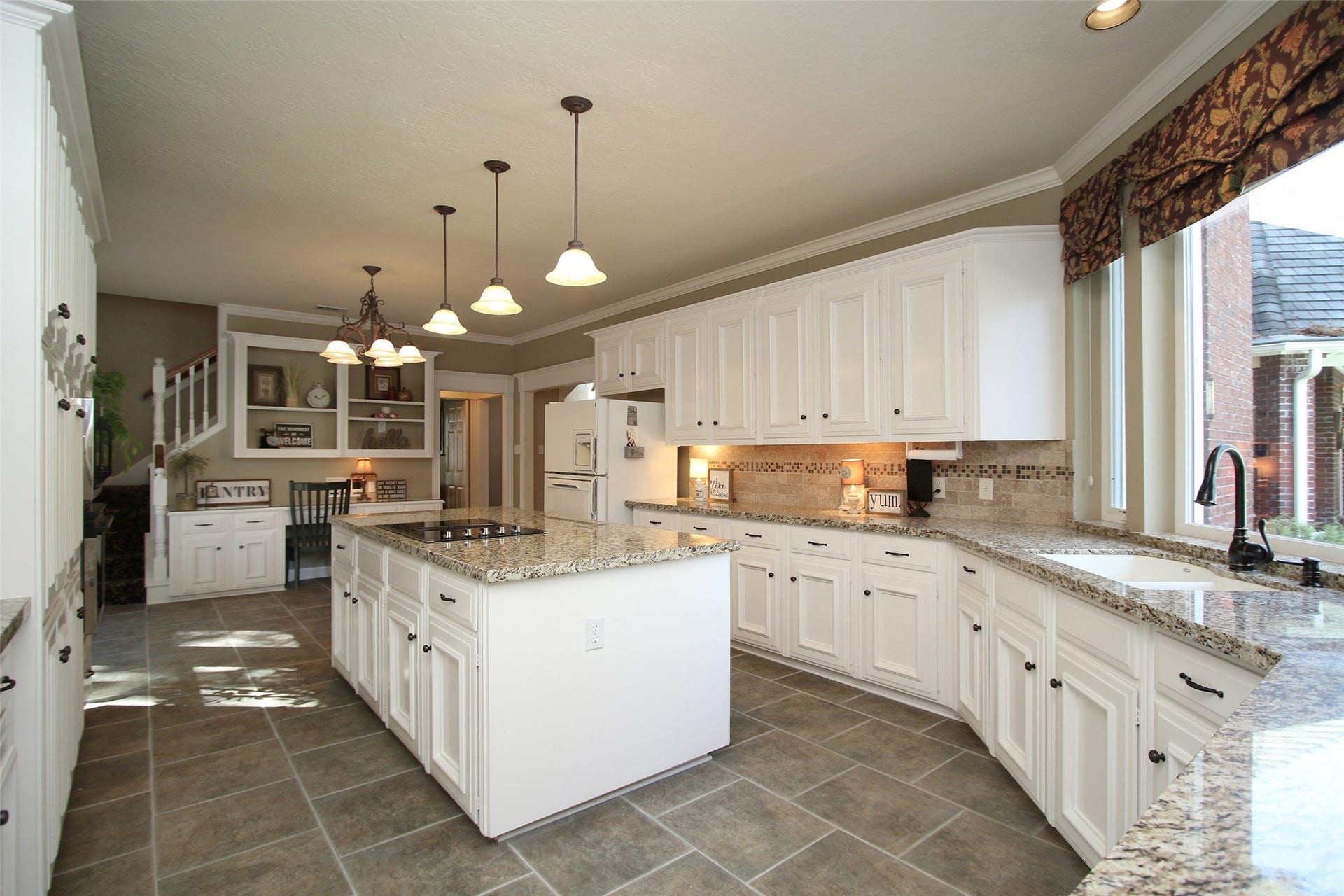 15914 Harwick Drive, Spring, TX 77379 A CHEFS DREAM AT 25X14 WITH MORE THAN AMPLE CABINET SPACE AND LARGE ISLAND. LARGE PICTURE WINDOW OVERLOOKING A TREMENDOUS BACK YARD POOL AND SPA.