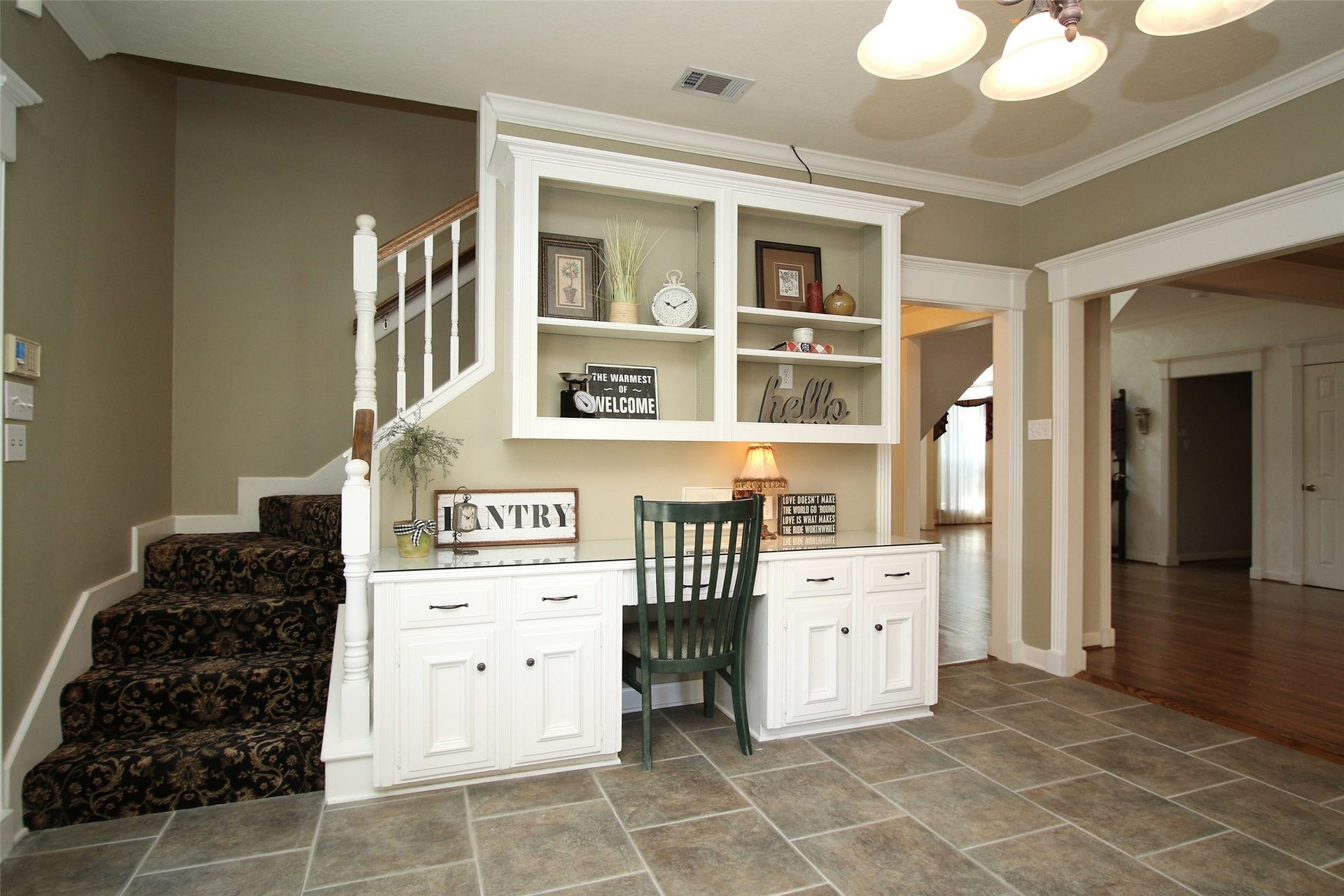 15914 Harwick Drive, Spring, TX 77379 BUILT IN DESK AREA IS CONVENIENTLY LOCATED IN THE KITCHEN WITH THE SECOND STAIRCASE TO THE LEFT, LEADING UPSTAIRS TO 4 BEDROOMS, 2 OTHER FULL SIZE BATHS AND A LARGE GAME ROOM.