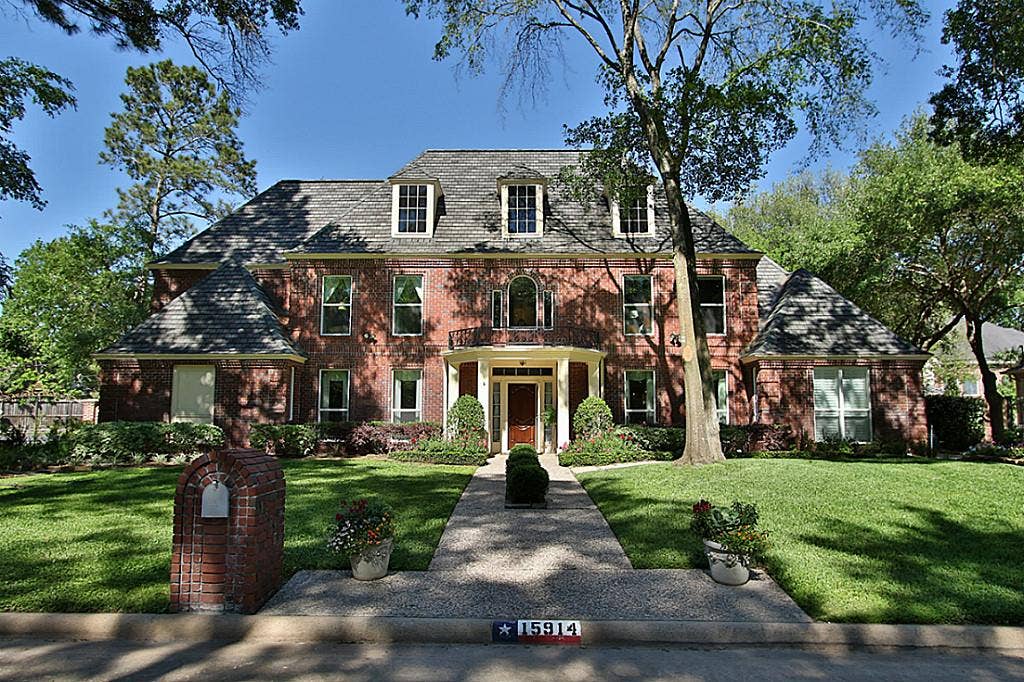 15914 Harwick Drive, Spring, TX 77379 STATELY ELEVATION WITH ALMOST ALL BRICK. This amazing estate is spread over 13,000 sqft of meticulous mature landscaping. A three car garage is just on the the other side of the automated gate. .