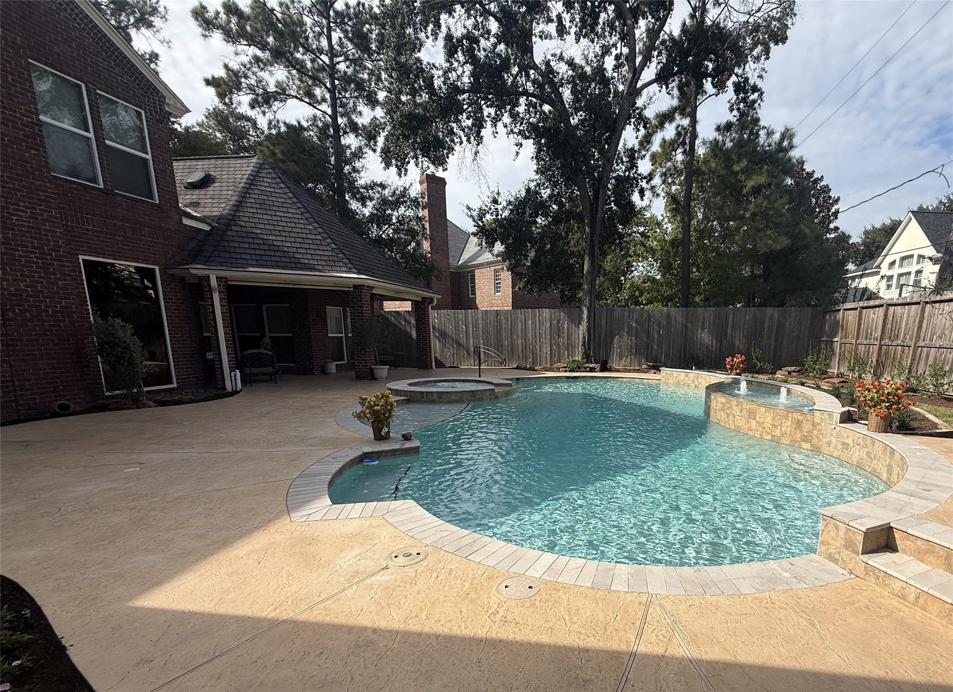 15914 Harwick Drive, Spring, TX 77379 REMODELED POOL WITH STAMPED CONCRETE PATIO