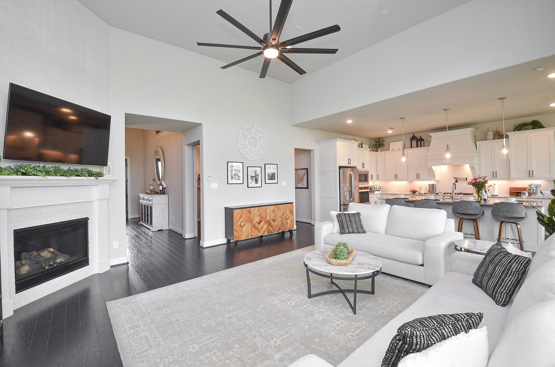 Welcome to the heart of your home, where an open-concept living room and cozy gas fireplace create the perfect setting for everyday moments and memorable celebratory gatherings like birthdays, baby showers and graduations.