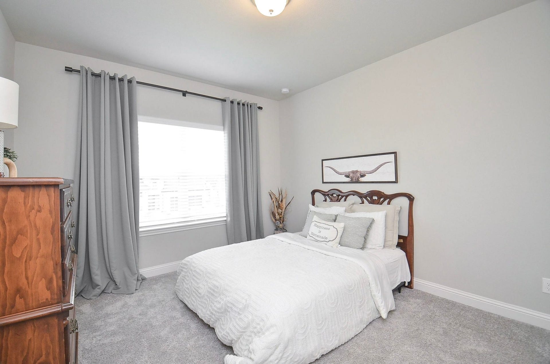 Your fourth bedroom measures 12' x 13' is an inviting space with a large window and plenty of room for comfortable furnishings.