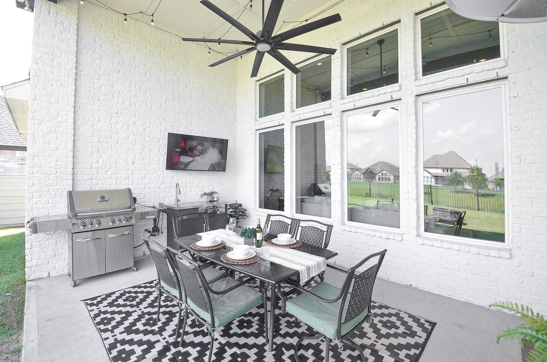 Step onto your covered patio, where a gas connection, ceiling fan and ample space for outdoor dining create an inviting setting to enjoy the Texas outdoors while extending your gatherings beyond the living room.