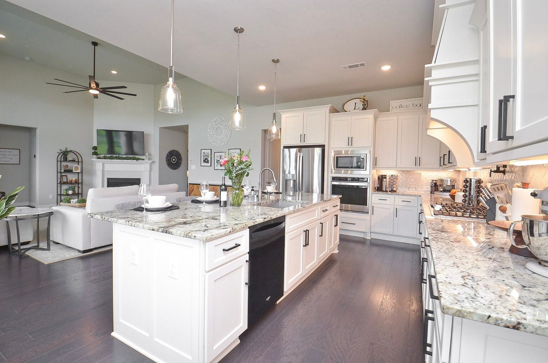 Beautifully appointed kitchen with extensive cabinetry, generous countertops, and a walk-in pantry.