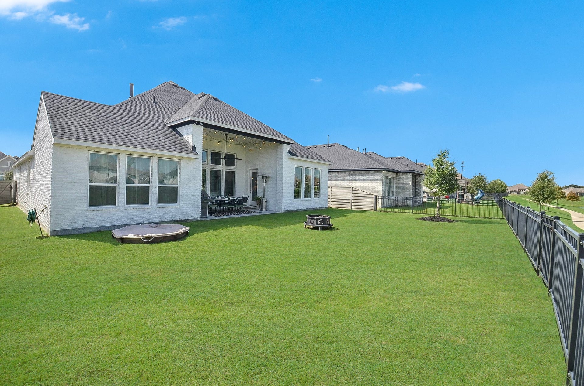 Your spacious backyard offers plenty of room, while open-view fencing preserves the beautiful lake views and peaceful waterfront setting.