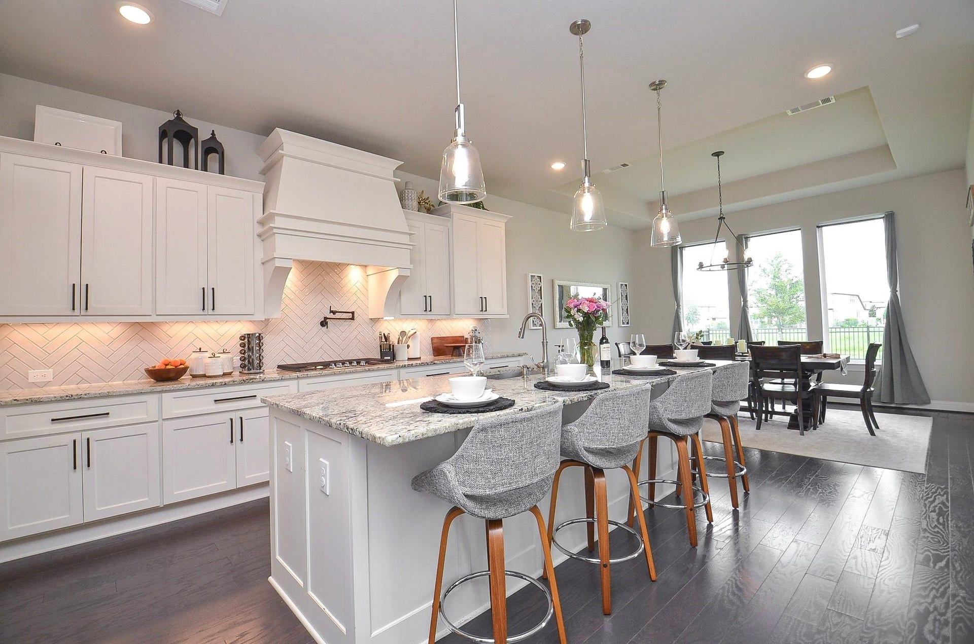 Your expansive kitchen island offers generous space for meal preparation and casual dining. When entertaining, the spacious breakfast bar also makes an ideal spot for serving guests buffet-style especially for the Thanksgiving holiday.