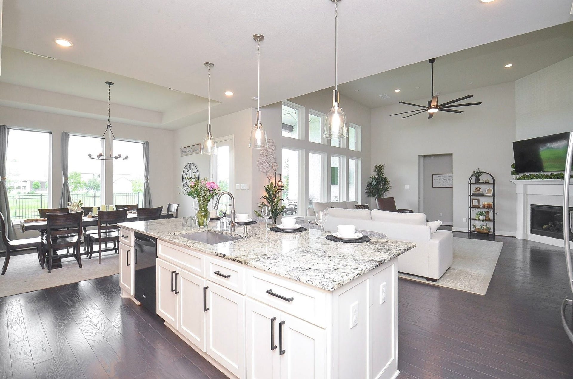 The seamless flow between your kitchen, dining, and living areas creates an inviting gathering space. As the evening winds down, let's make our way to your first-floor primary suite.