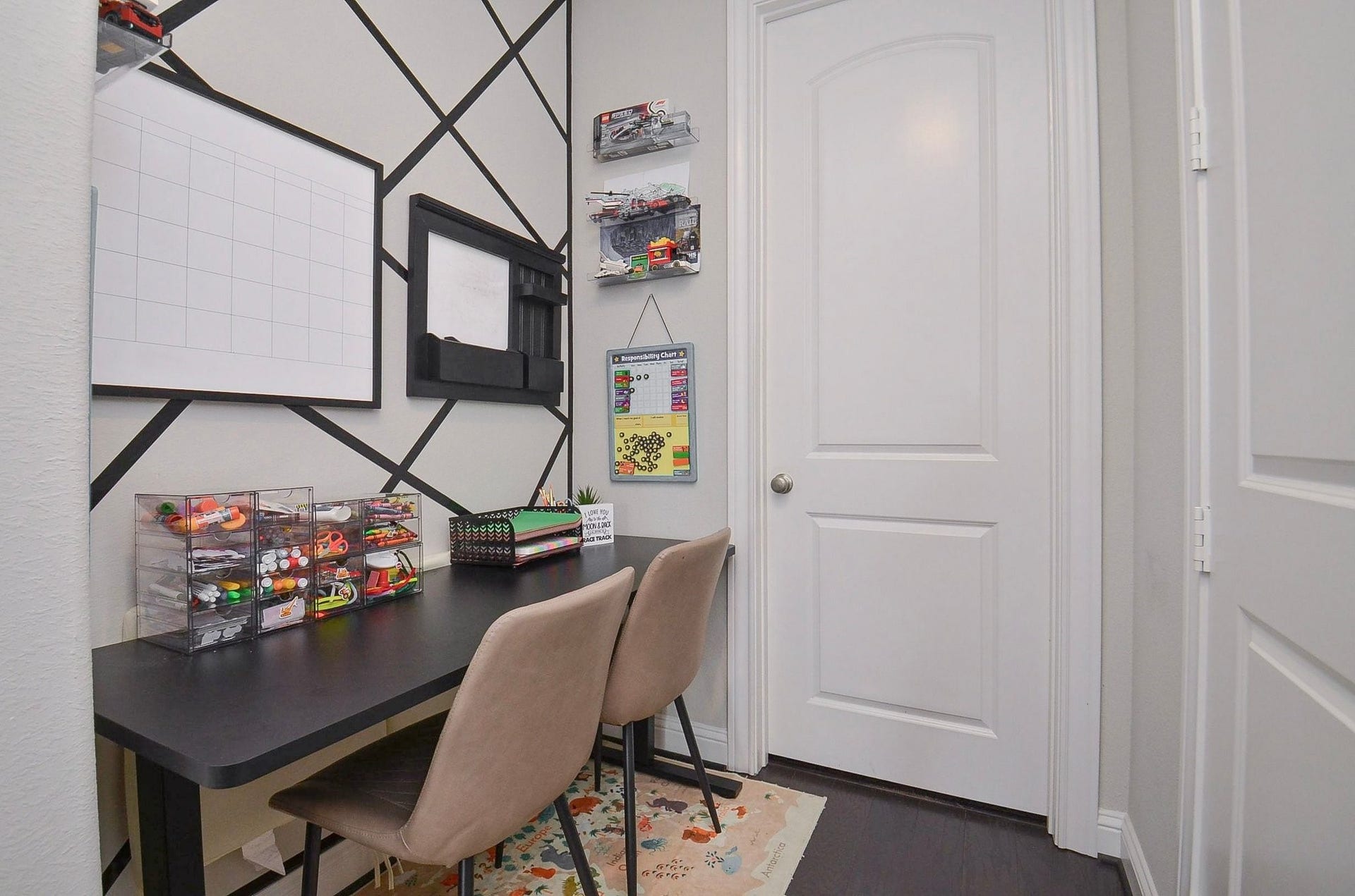 Located near your garage entry, this versatile nook is currently arranged as a workspace for two but can easily serve as a mudroom, homework station, or creative space.