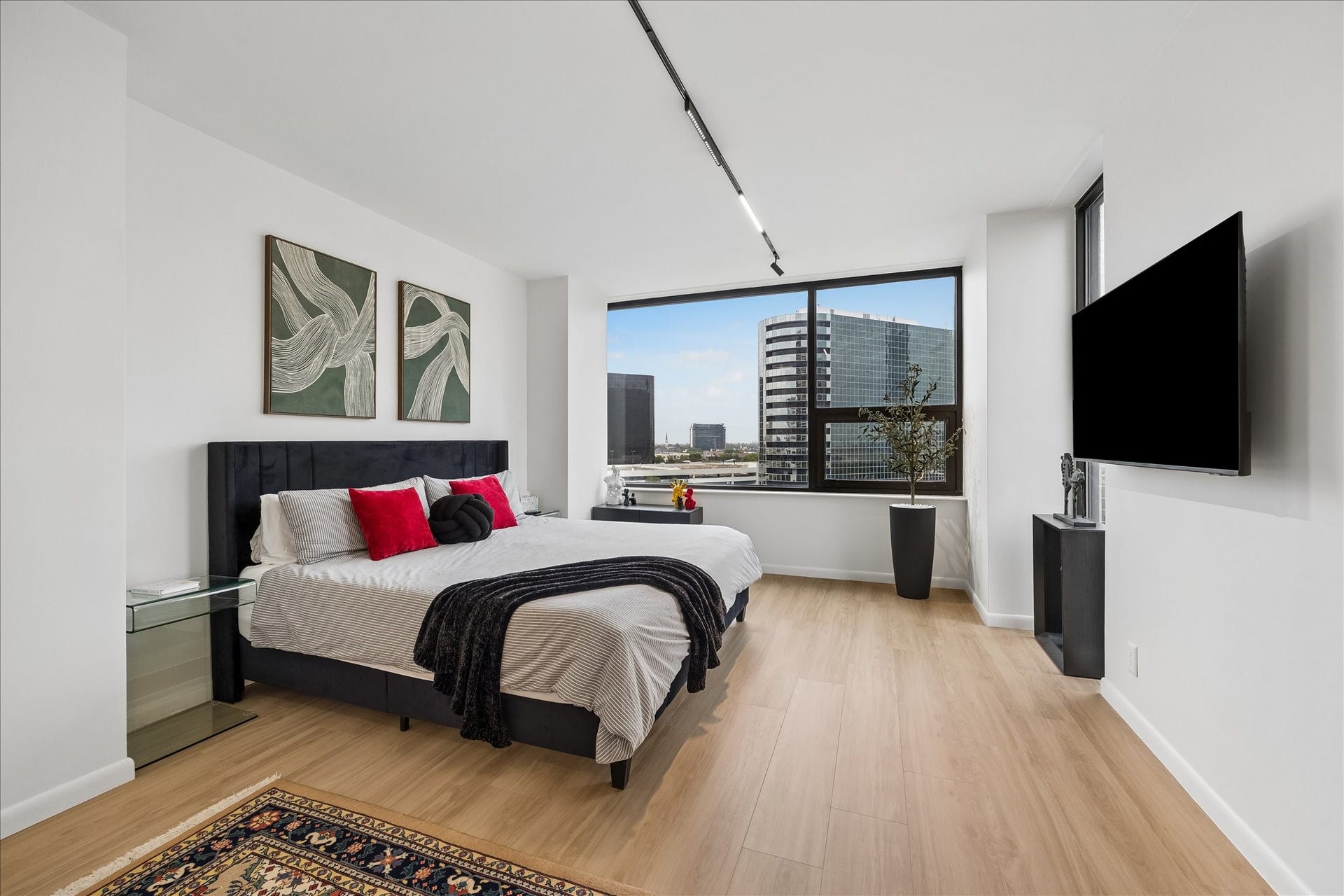 14 Greenway Plaza, #9R, Houston, TX 77046 Dedicated smart thermostat serves the primary bedroom, where a broad window frames city views.