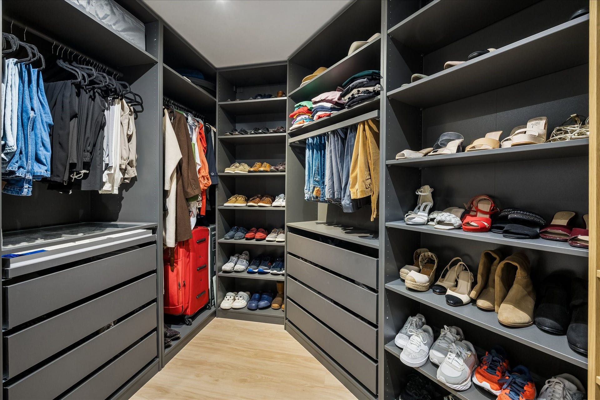 14 Greenway Plaza, #9R, Houston, TX 77046 Open shelves, drawers and hanging rails show the closet's storage capacity from the opposite side.