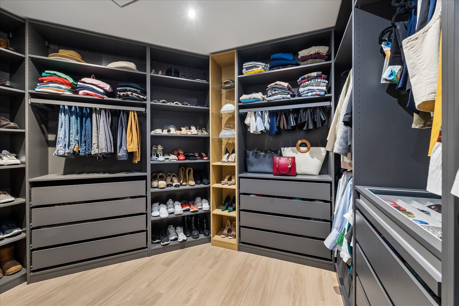 14 Greenway Plaza, #9R, Houston, TX 77046 Fitted closet combines hanging space, drawers and open shelving around a central aisle.