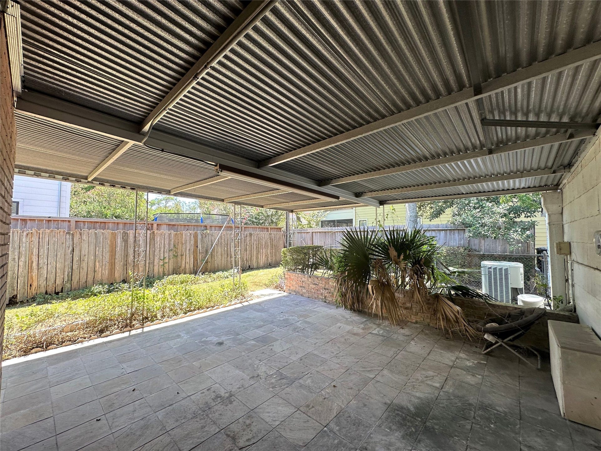 Large back covered patio with access from both the additional living area/den and the breakfast/dining area.  Plenty of room for sitting area and patio table to relax and entertain back here!