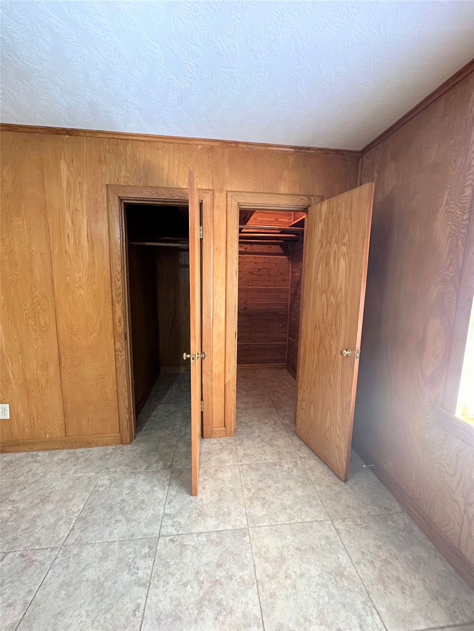 Primary bedroom offers 2 walk-in closets for plenty of storage space.
