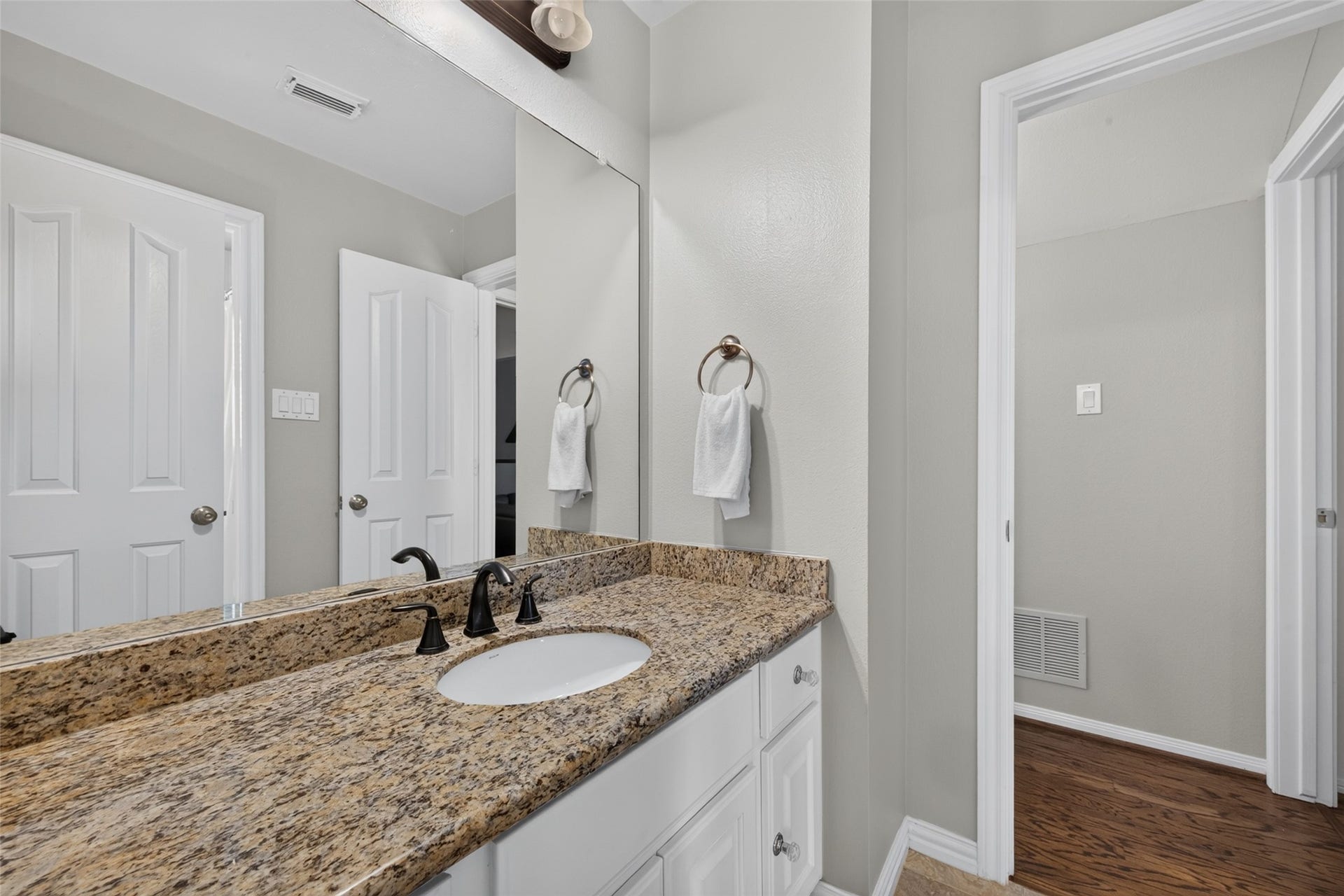 13611 Cottage Arbor Court, Sugar Land, TX 77498 Private third full bathroom serving the fourth bedroom, featuring a granite vanity and a clean, neutral finish.