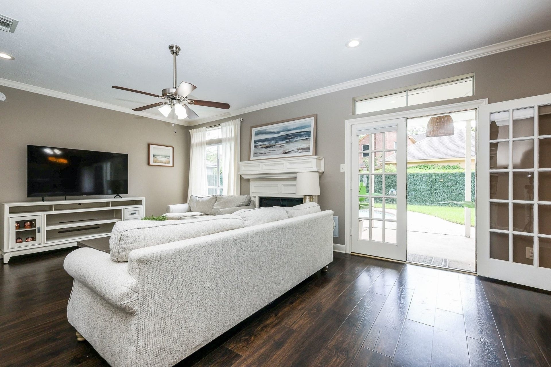 118 Mill Trail Drive, Sugar Land, TX 77498 Living area with engineered floors and french doors open to backyard oasis!