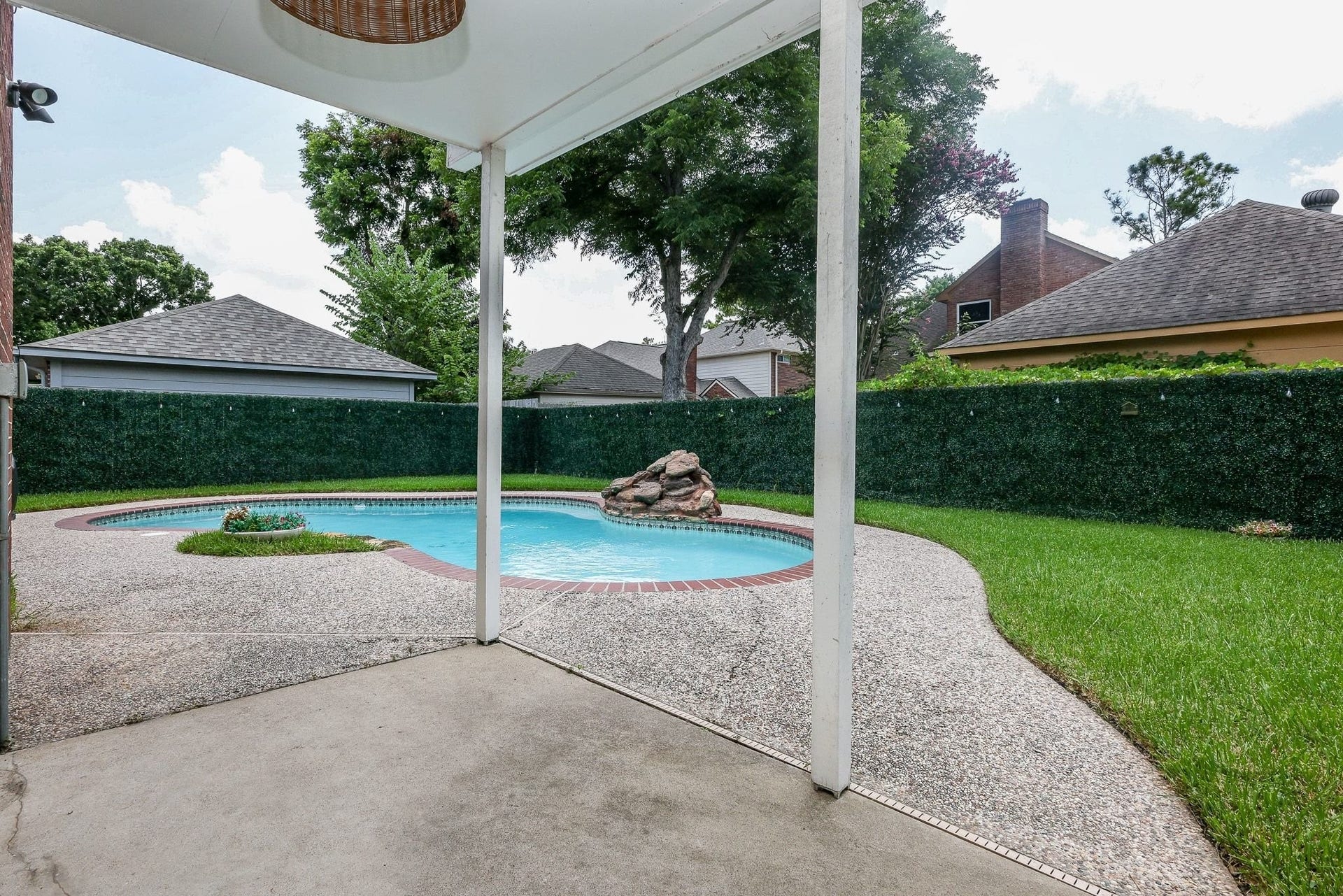 118 Mill Trail Drive, Sugar Land, TX 77498 Outdoor covered space and pebbled deck.