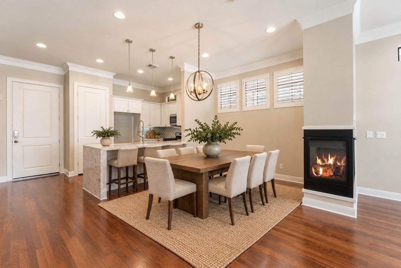 24 Riva Row, Spring, TX 77380 Firelit dinners start here, with the kitchen on one side and a three-sided fireplace on the other. Virtually staged.