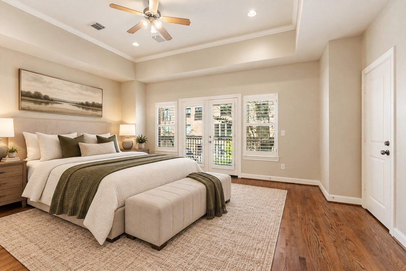 24 Riva Row, Spring, TX 77380 The primary retreat easily fits a king-size bed, with French doors opening to a private balcony. Virtually staged.