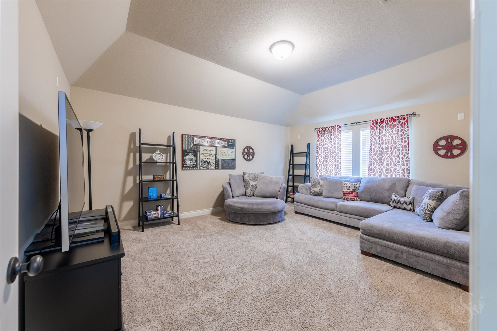 5219 Kenton Place Lane, Fulshear, TX 77441 Enjoy favorite films and game-day excitement in the separate upstairs media room, with ample space for comfortable lounge seating. This inviting retreat makes it easy to settle in for a relaxing evening or host friends for movie night.