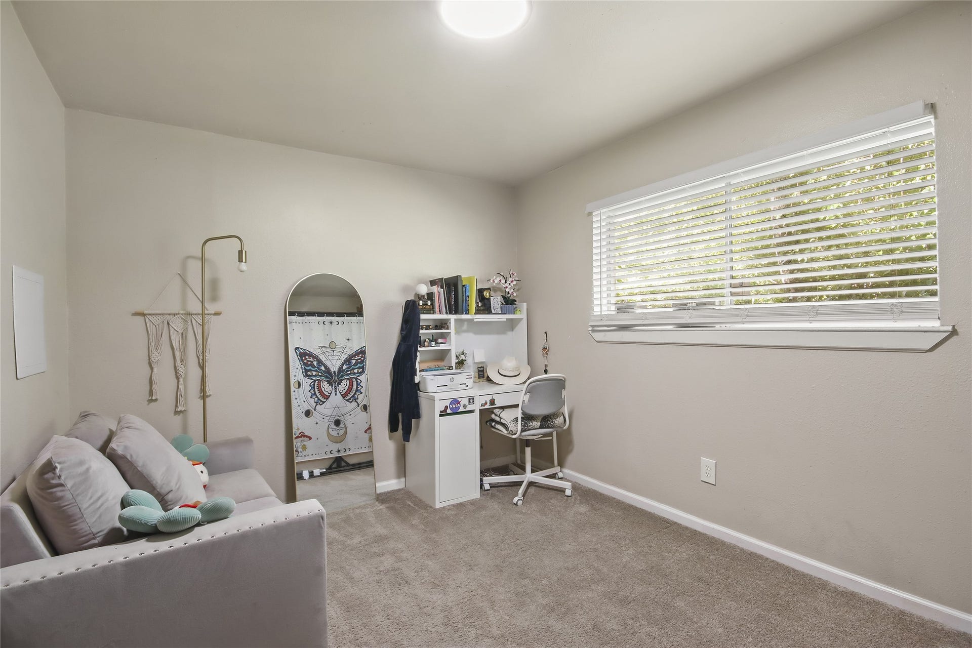 910 Centerwood Drive, Houston, TX 77013 This secondary bedroom offers plush carpet and a large window with plenty of natural light.