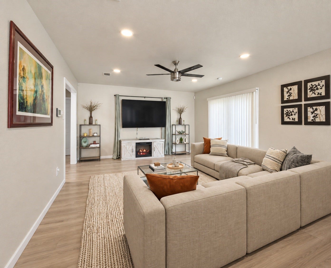 910 Centerwood Drive, Houston, TX 77013 The living area features recessed lighting, a ceiling fan, and a new sliding glass door that fills the room with natural light. Virtually staged.