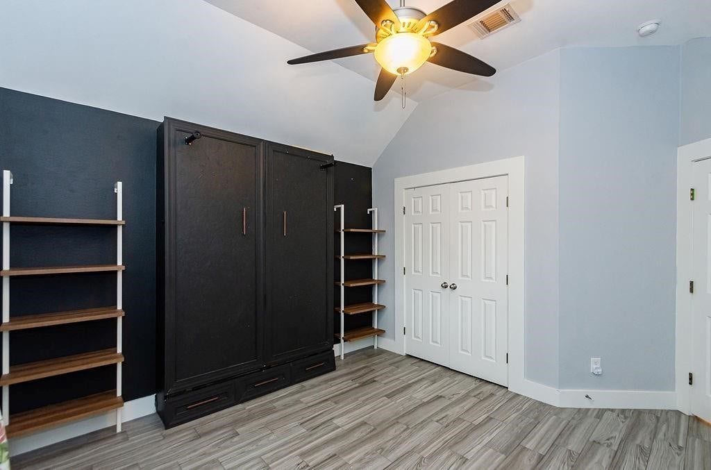 One of the three secondary bedrooms. Each room has large closets and this one has a ton of extra storage