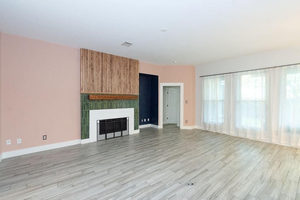 The wood slats above the fireplace add a touch of elegance
