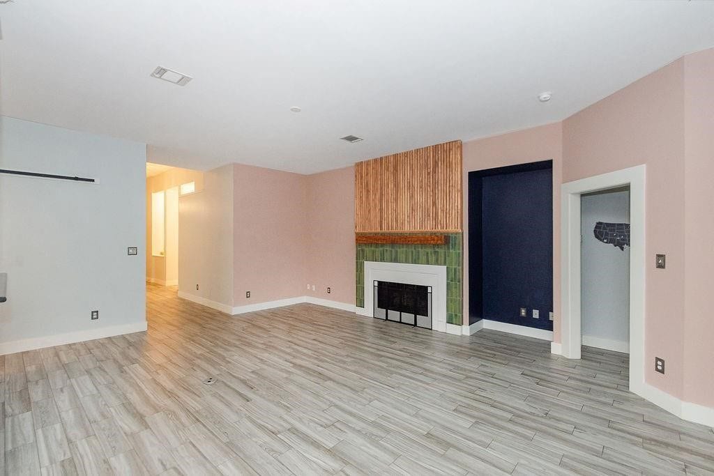 Great shot of the living room with large fire place makes this a very cozy space