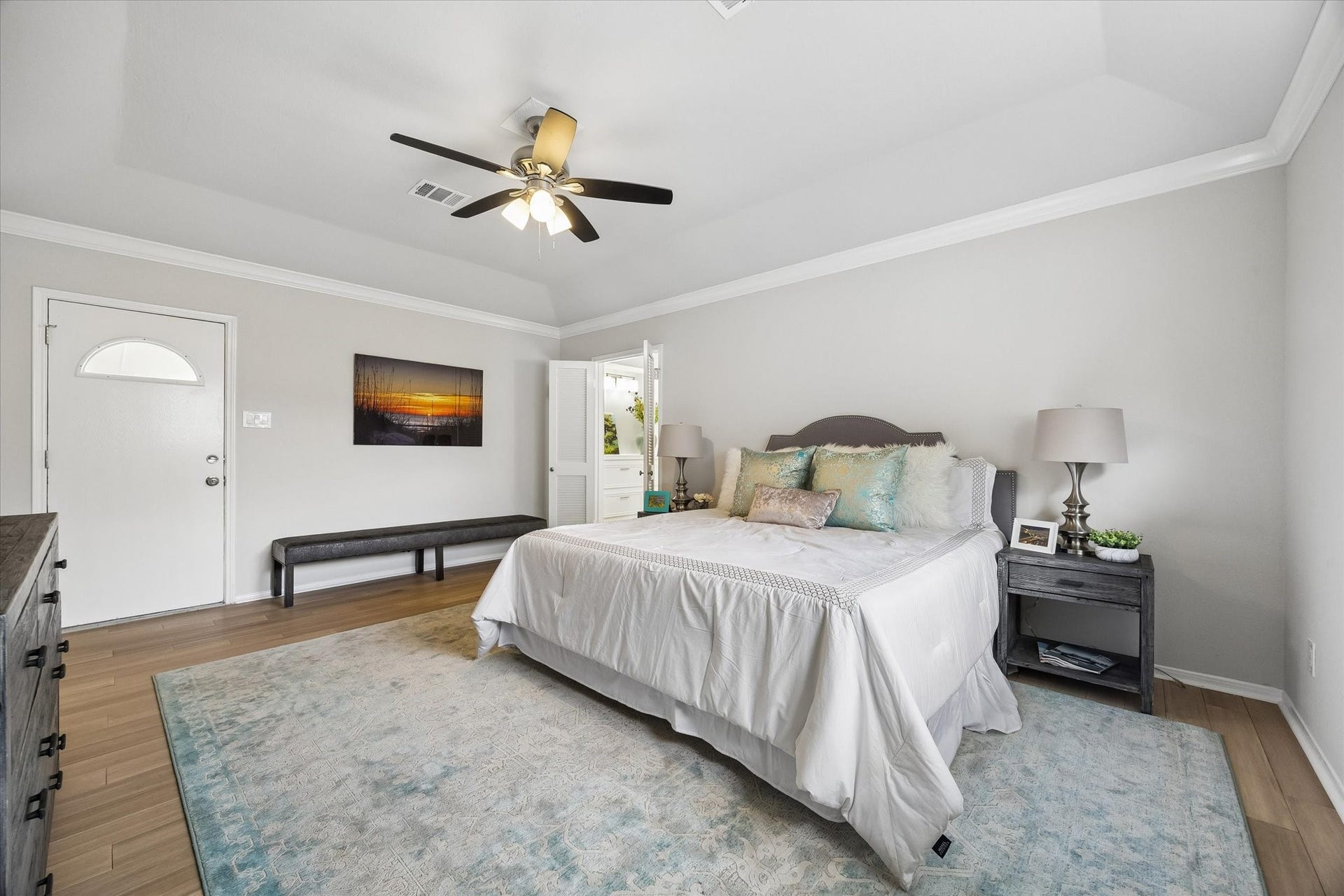3122 Peach Tree Lane, Missouri City, TX 77459 The primary bedroom is bright and welcoming, with a door leading to the outdoor patio area.