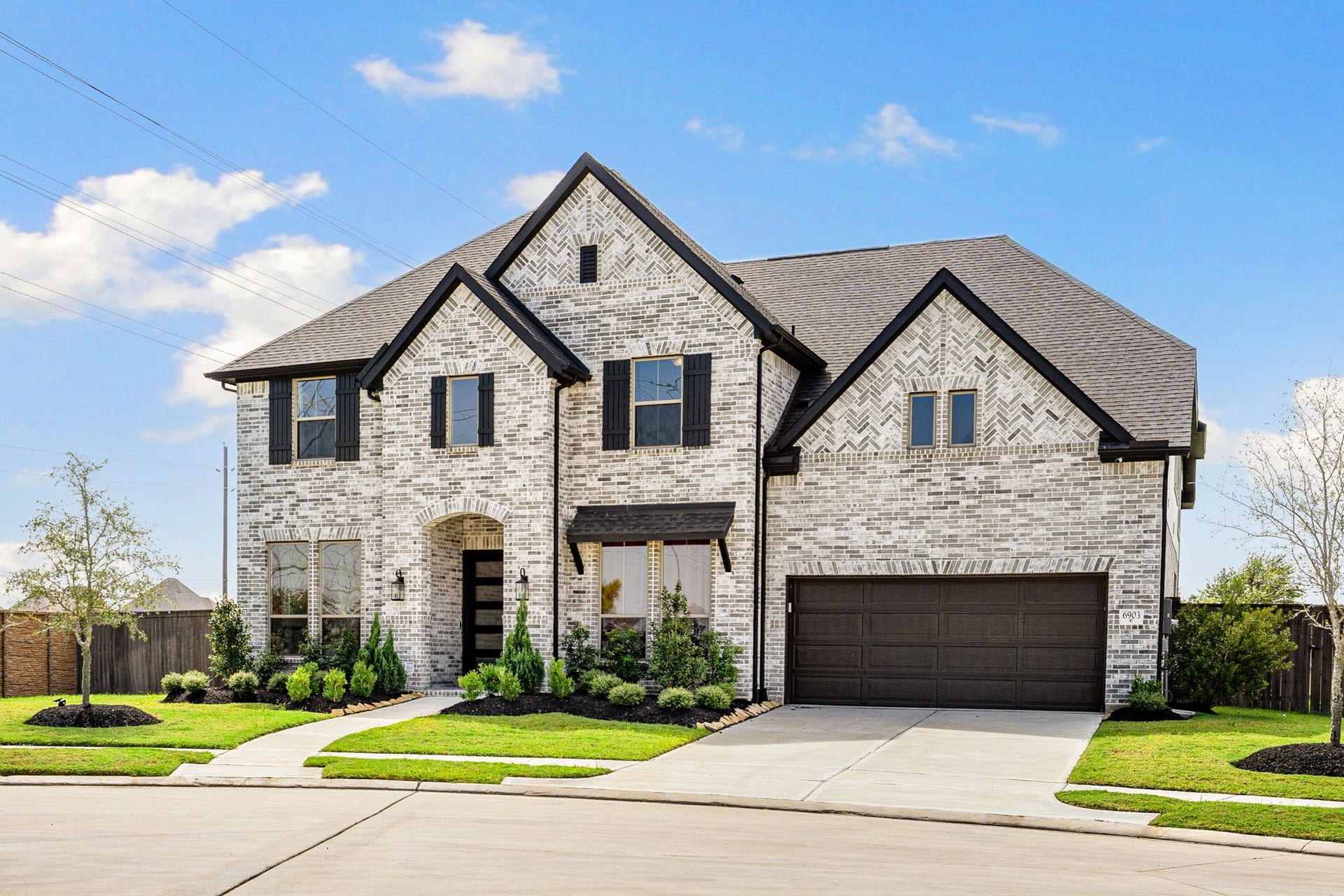 6903 Shoreline View Drive, Katy, TX 77493 Stunning two-story brick home with elegant gables!