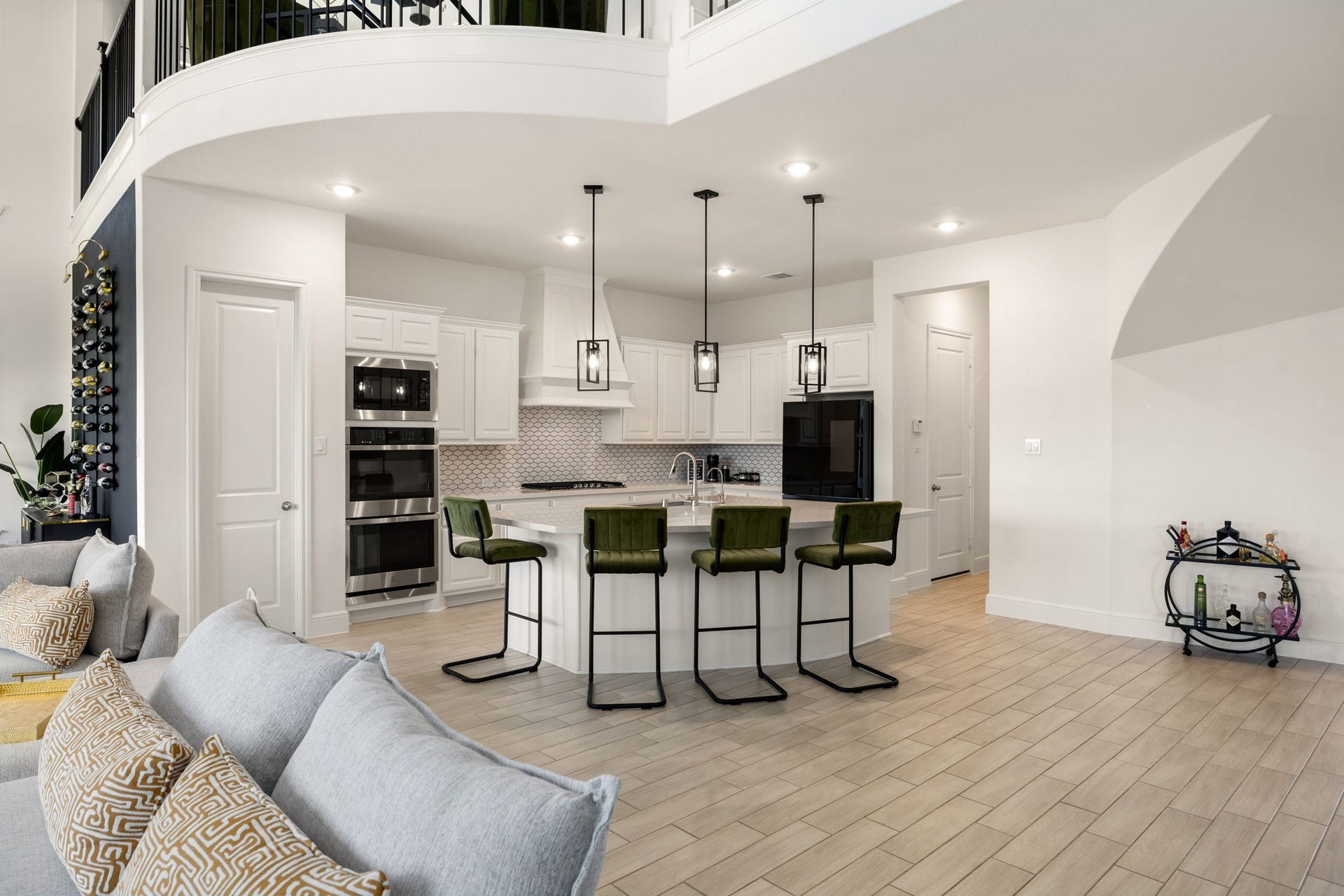 6903 Shoreline View Drive, Katy, TX 77493 Sleek white cabinetry, a stylish island with seating, and contemporary pendant lighting!