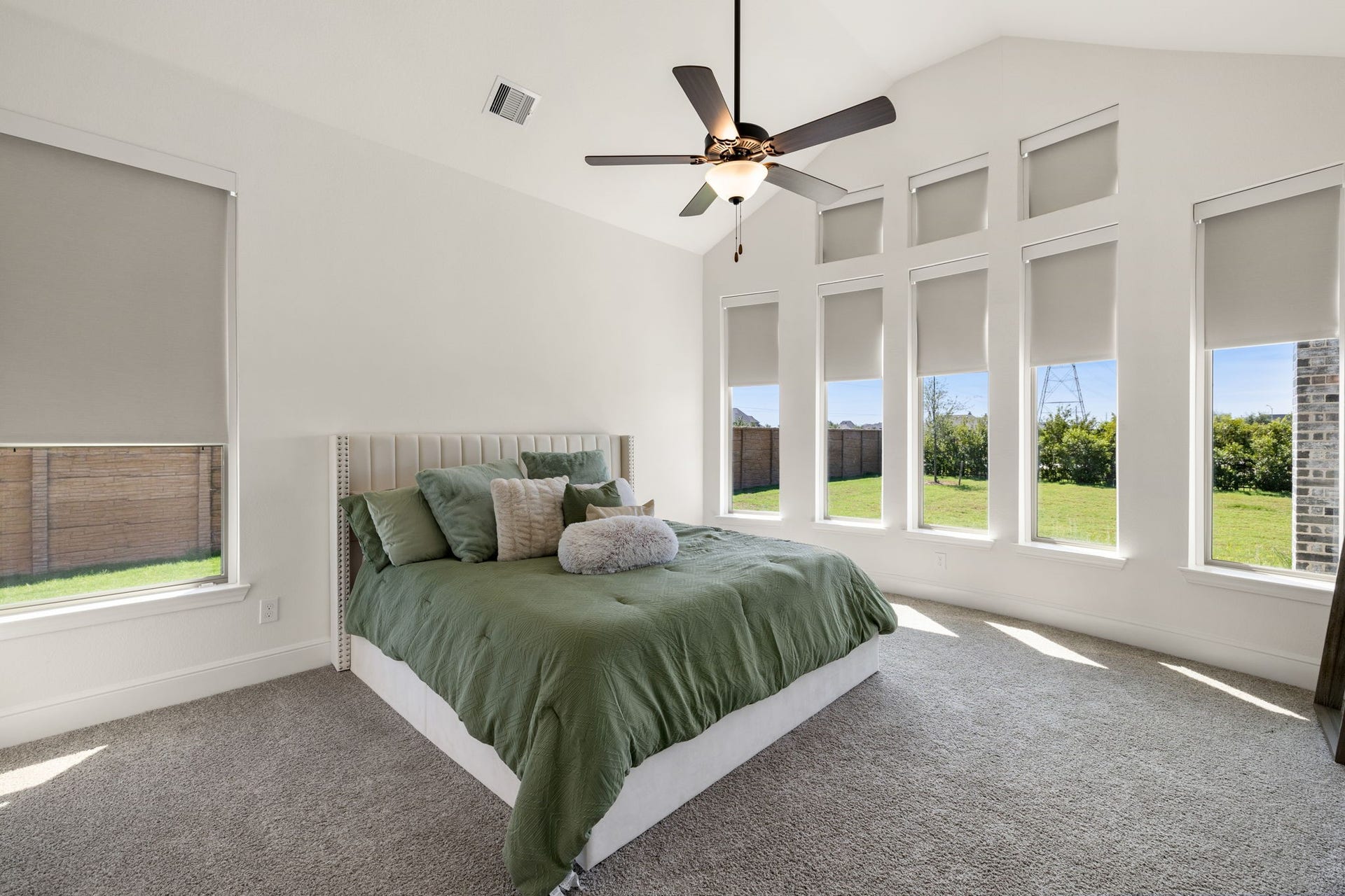 6903 Shoreline View Drive, Katy, TX 77493 Primary bedroom with serene views of the lush backyard!