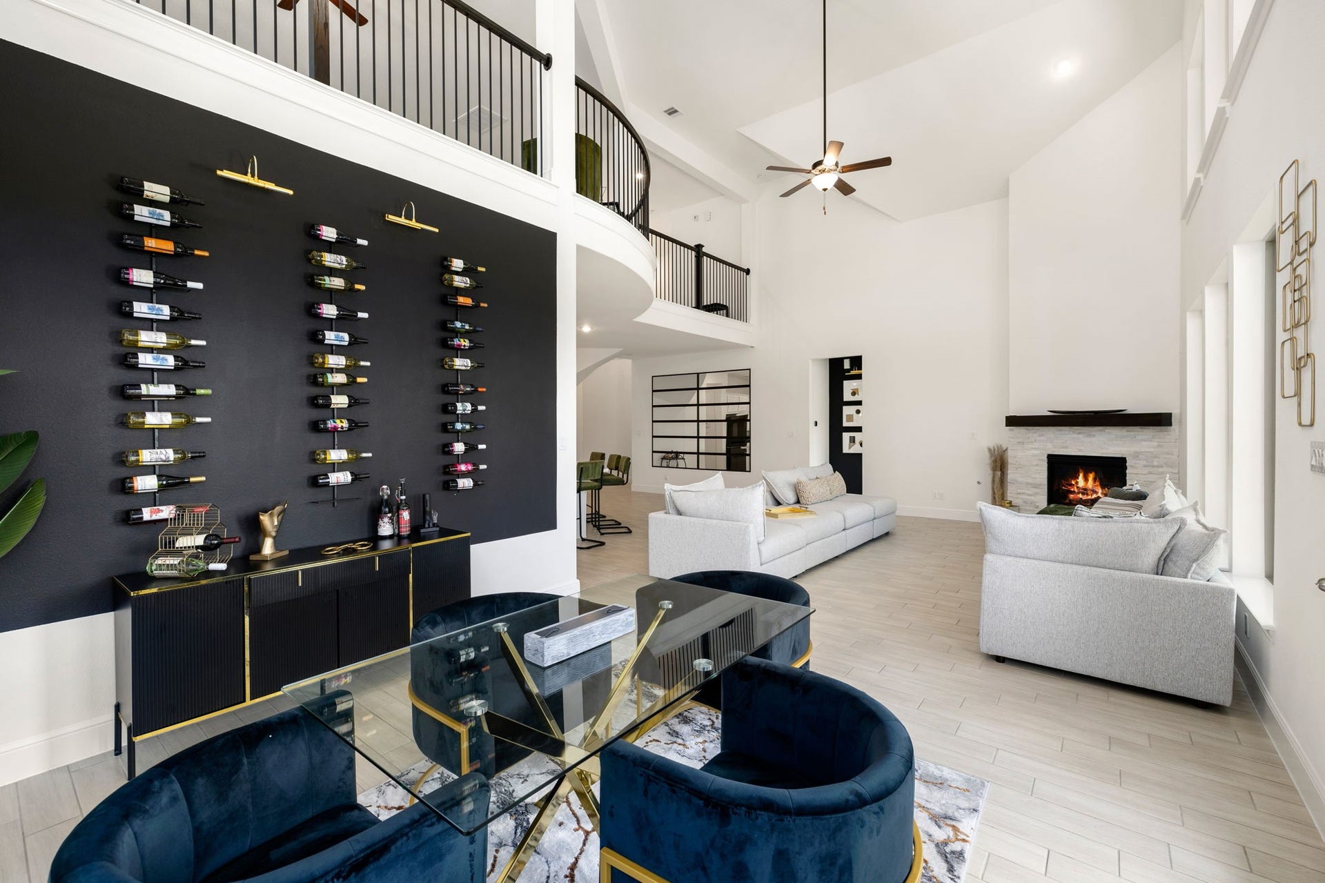 6903 Shoreline View Drive, Katy, TX 77493 Striking wine display wall, complemented by elegant furnishings and abundant natural light!