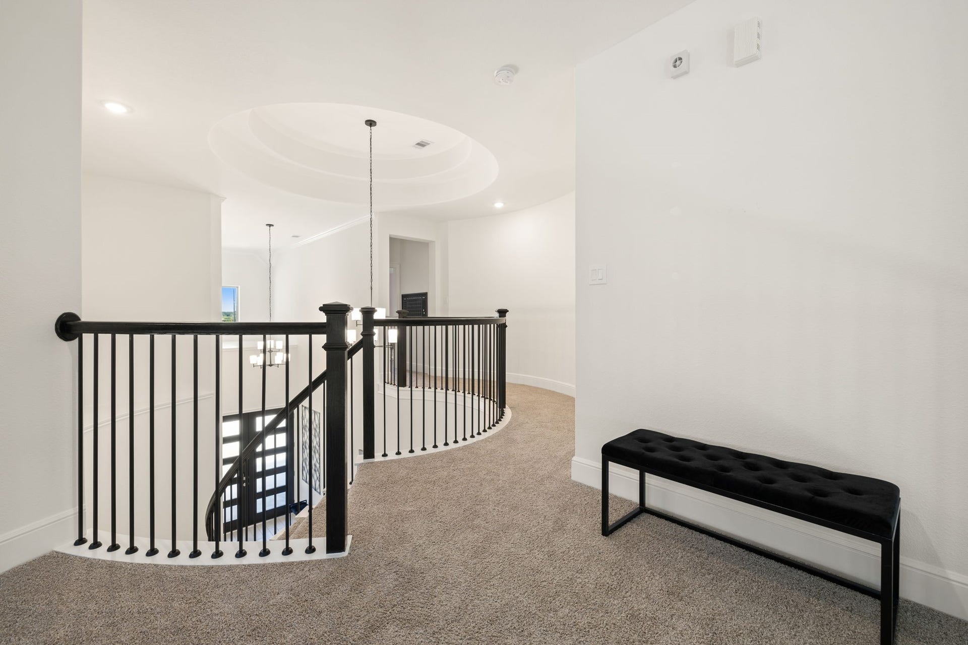 6903 Shoreline View Drive, Katy, TX 77493 Upper landing with plush carpeting, featuring a stylish black iron railing!