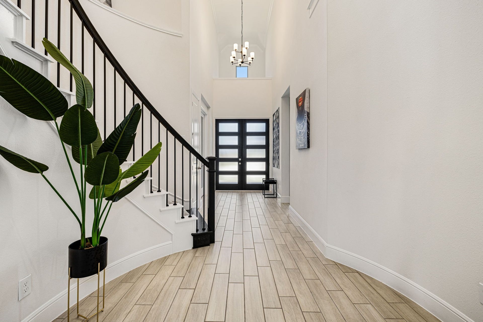 6903 Shoreline View Drive, Katy, TX 77493 Grand entryway with stylish tile flooring, and natural light streaming through a sleek glass-paneled front door!