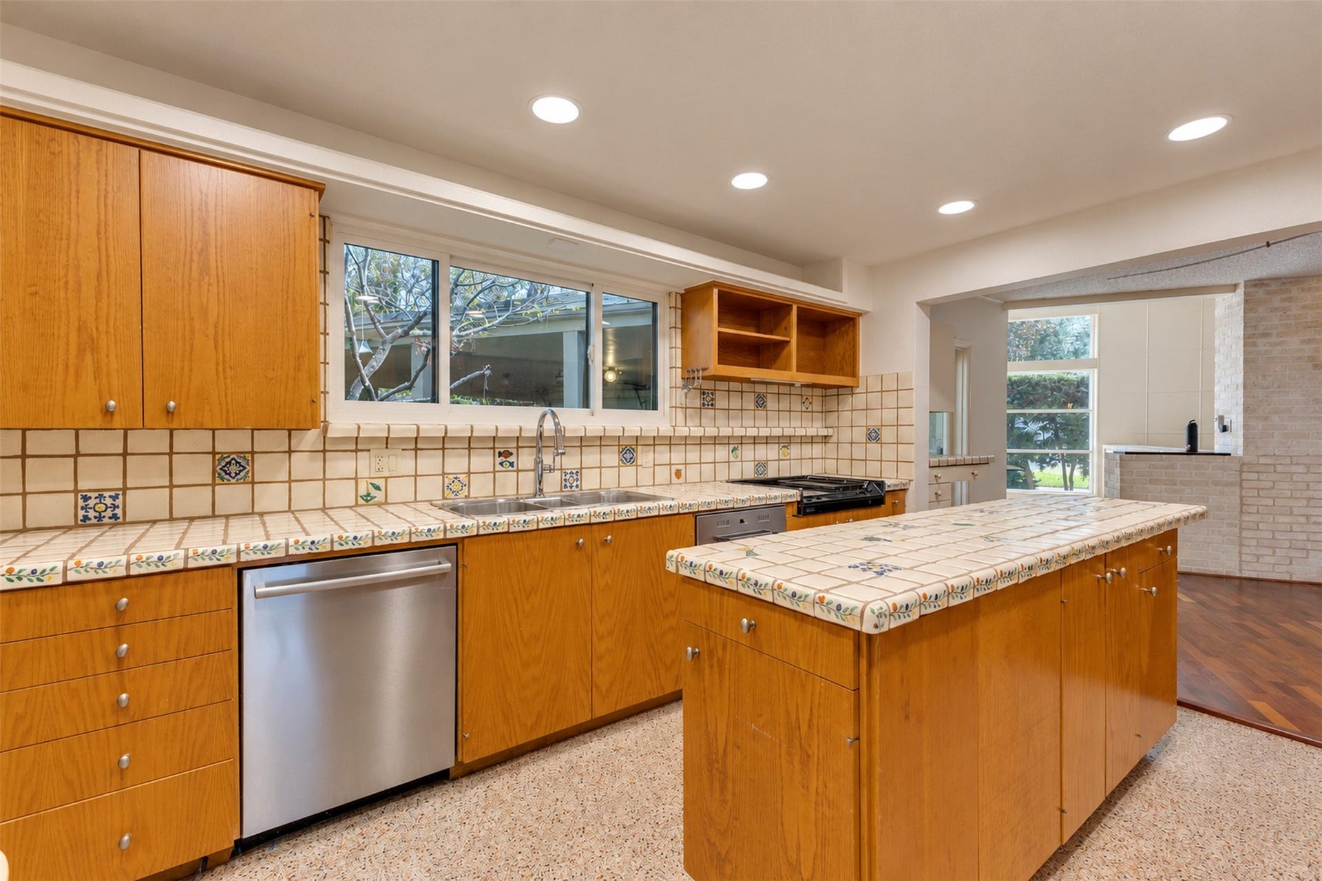 The kitchen with its island and plentiful counters and storage spaces.