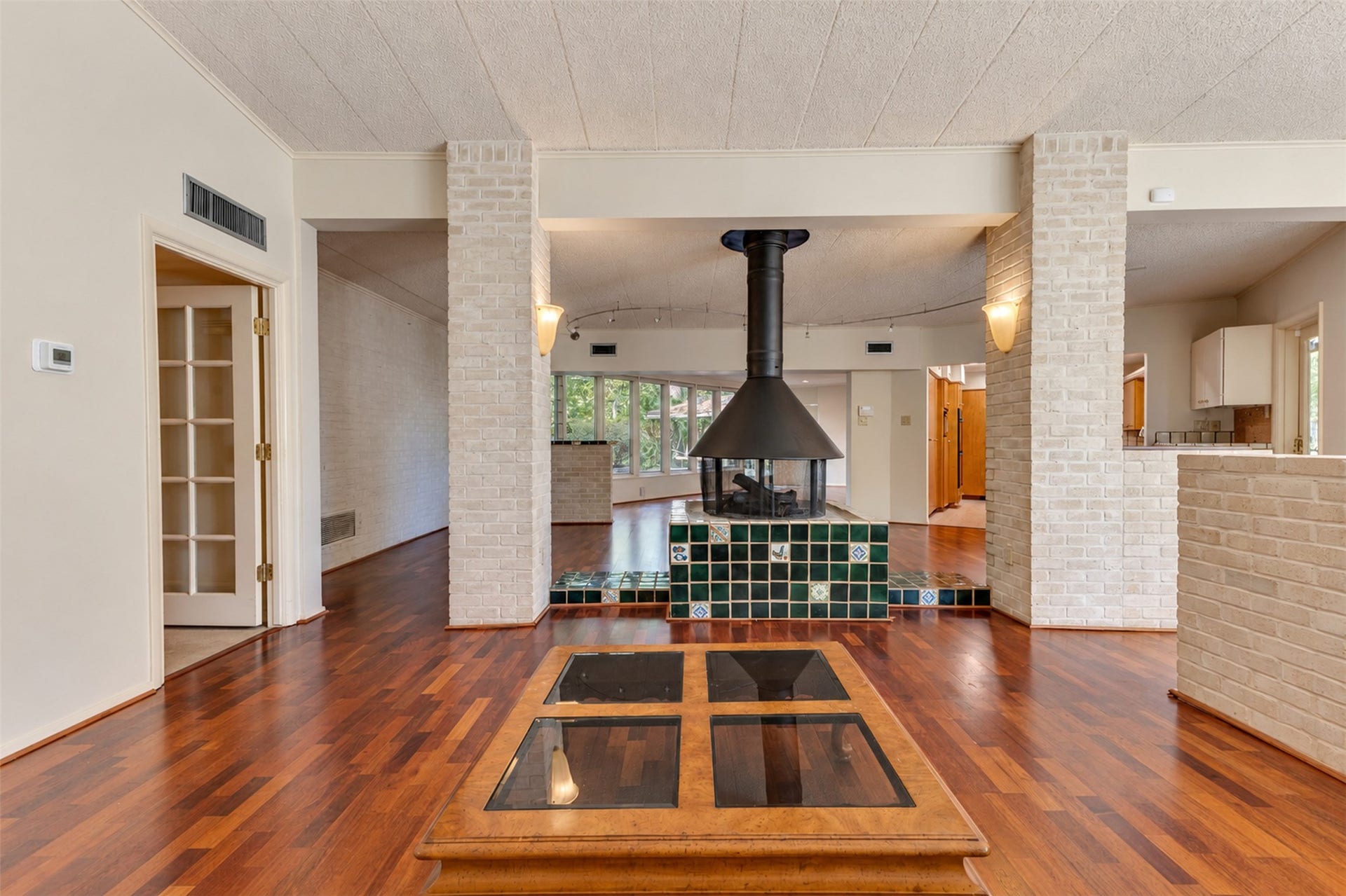 Enter into a unique home with multiple living spaces.