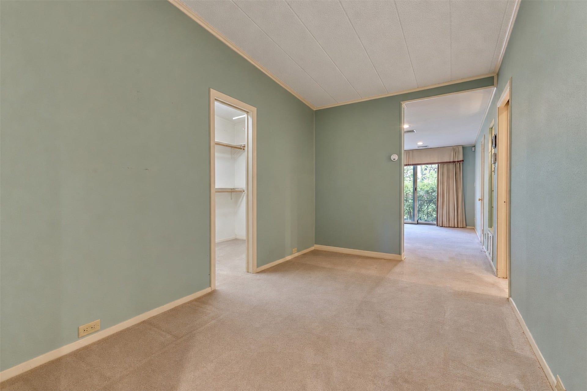 The master suite has an additional seating area, and multiple closets.