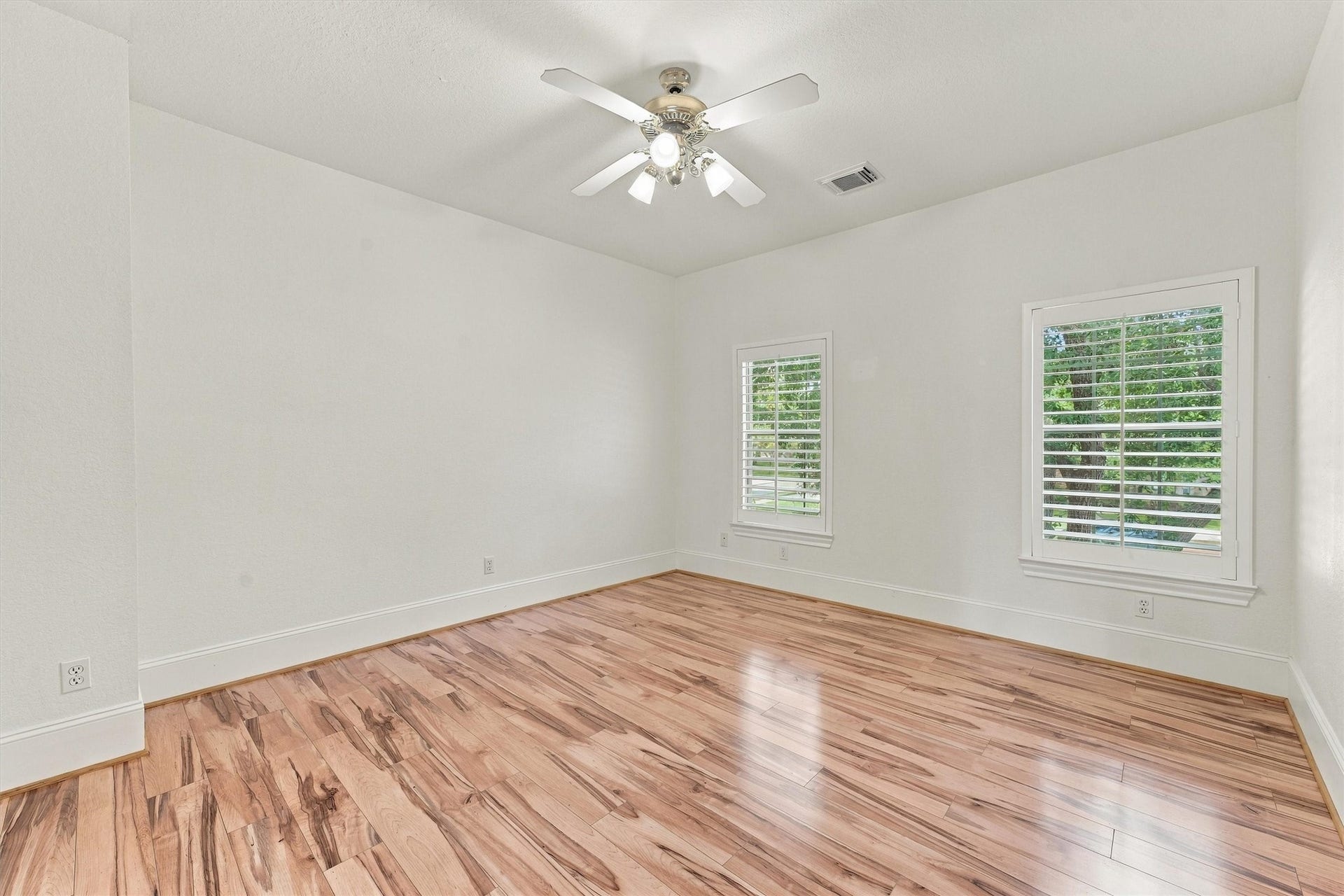 22415 Elizabeth Place Court, Katy, TX 77494 Second floor - Fouth Bedroom with ceiling fan, wood flooring, and two windows with plenty of natural light.