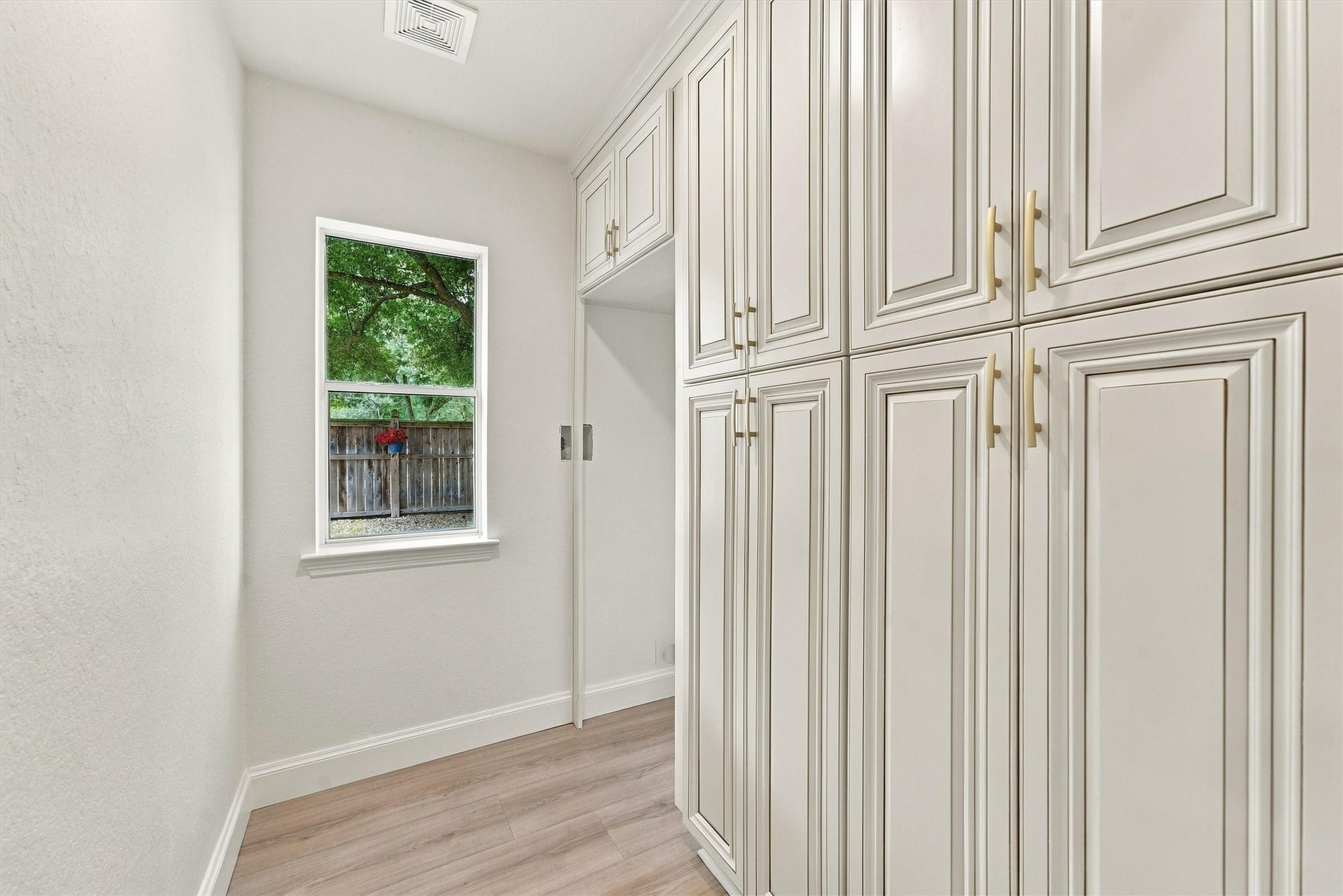 22415 Elizabeth Place Court, Katy, TX 77494 Primary bedroom (down) - custom closet built in cabinets with abundant cabinet storage.