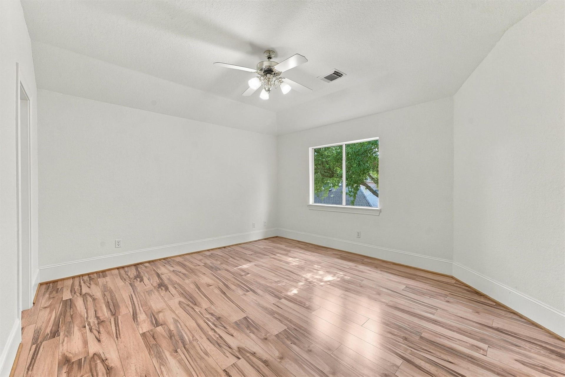 22415 Elizabeth Place Court, Katy, TX 77494 Upstairs second bedroom with ceiling fan and wood floors.