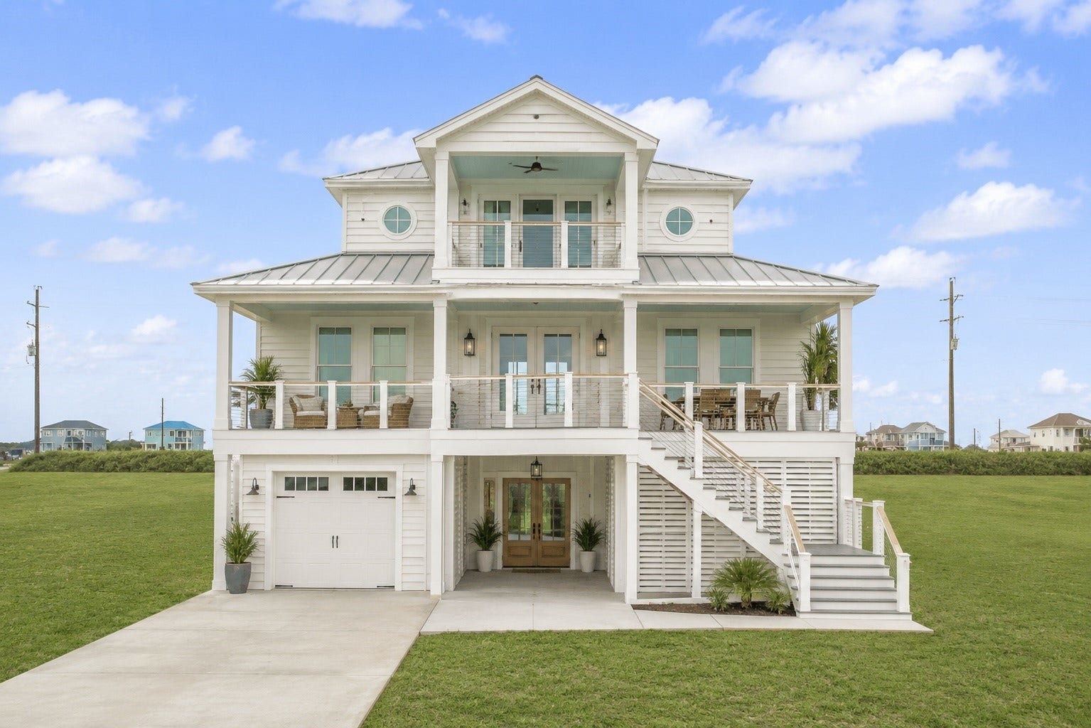 21205 Scissor Tail Lane, Galveston, TX 77554 Virtual example showing what could be built on the lot, with an elevated coastal design, broad front porches, and a light exterior palette suited for the Galveston setting. A helpful visual for imagining the scale, style, and beach-house potential of the homesite.