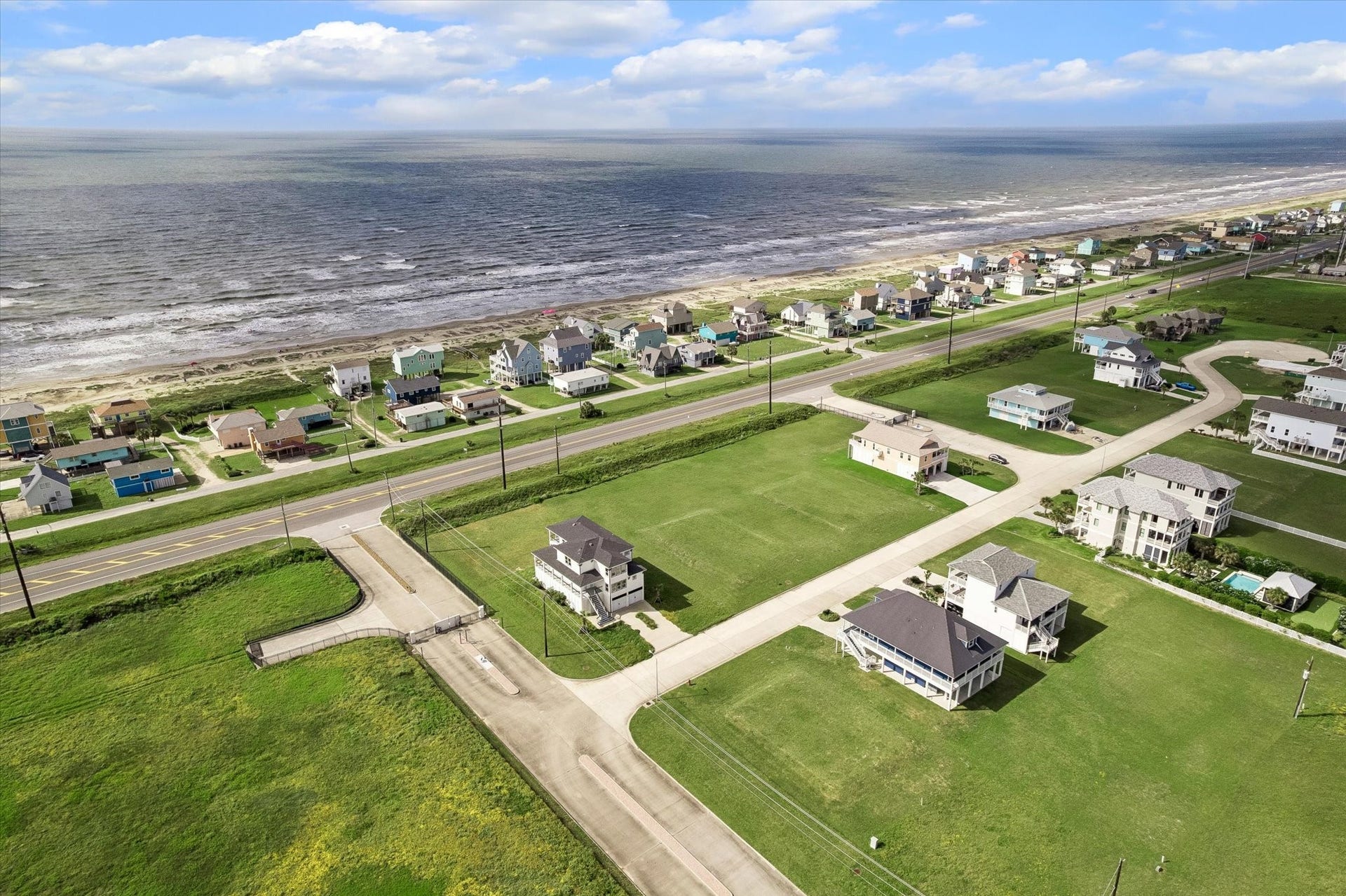 21205 Scissor Tail Lane, Galveston, TX 77554 Sunset Cove unfolds toward the shoreline in this sweeping view, with the beach an easy reach from your front door.