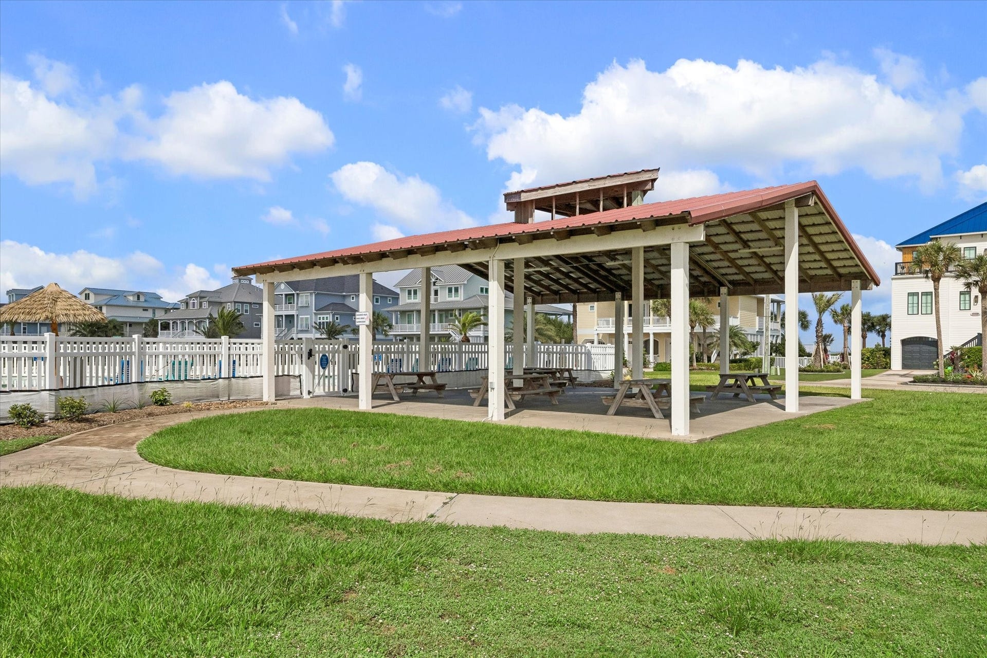 21205 Scissor Tail Lane, Galveston, TX 77554 A covered pavilion shaded by a timber-trussed roof invites cookouts and shaded afternoons by the water.